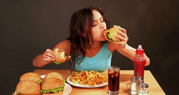 stock-footage–woman-eating-fast-food-time-lapse